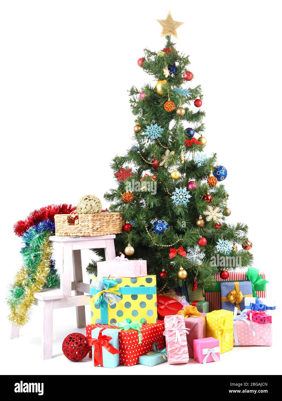 Decorated Christmas tree with gifts isolated on white Stock Photo - Alamy