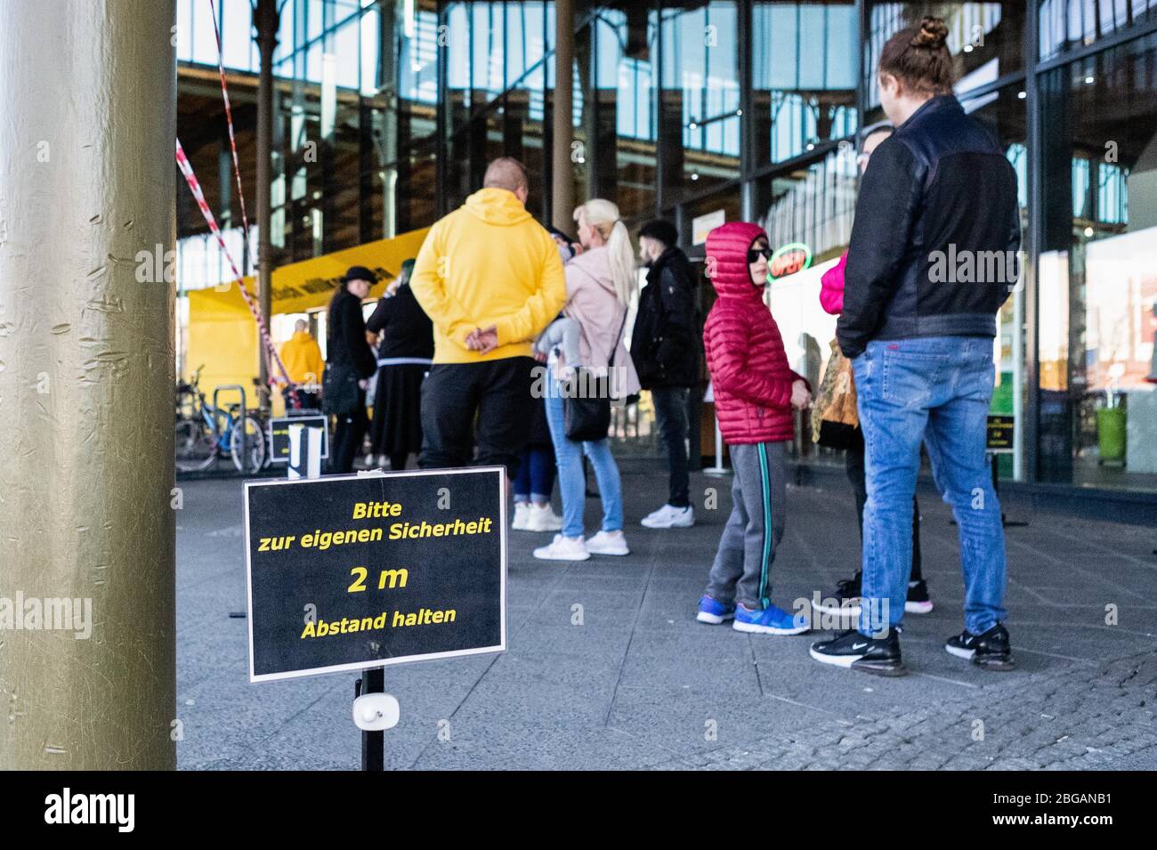 Berlin, Germany. 20th Apr, 2020. People queue to enter a bicycle shop in Berlin, capital of Germany, April 20, 2020. Starting from Monday, shops in Germany with a maximum sales area of up to 800 square meters are allowed to open under new regulations for hygiene as well as access and queue control. Credit: Binh Truong/Xinhua/Alamy Live News Stock Photo