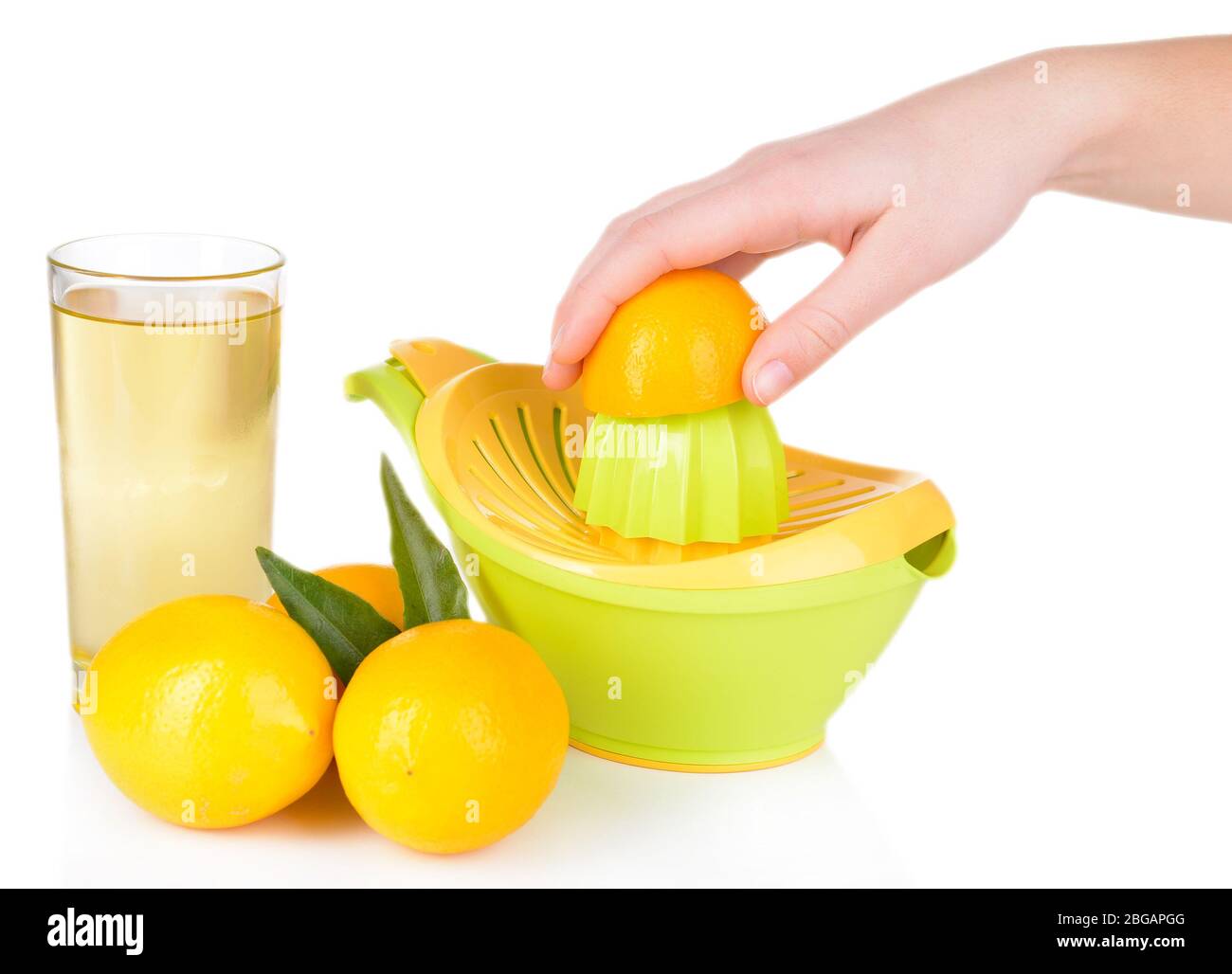 Preparing fresh lemon juice squeezed with hand juicer isolated on white