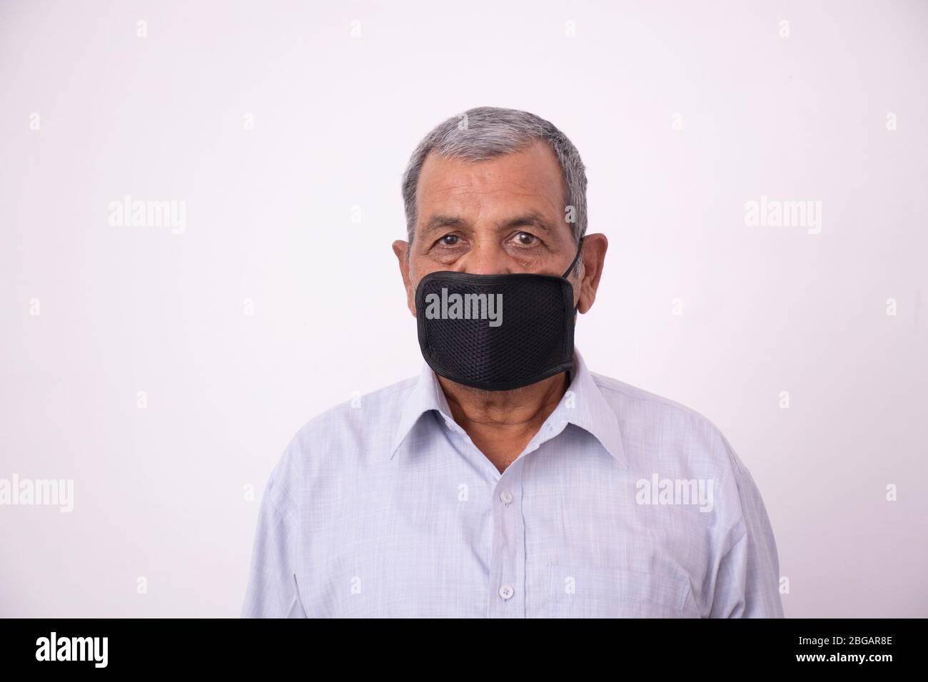 Old indian man wearing mask hi-res stock photography and images - Alamy
