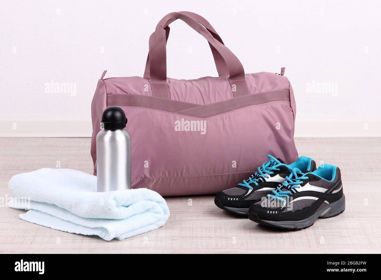 Sports bag with sports equipment in gymnasium Stock Photo Alamy