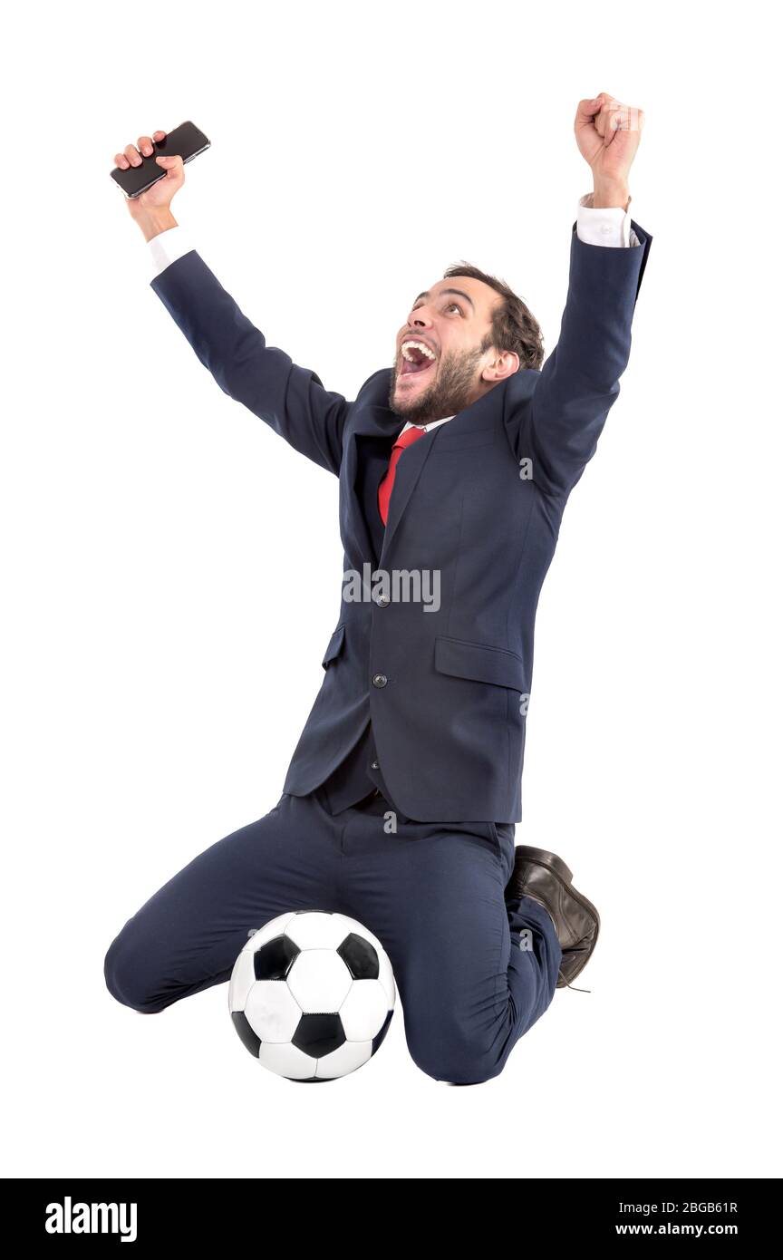 Businessman with soccer ball celebrating isolated in white Stock Photo ...
