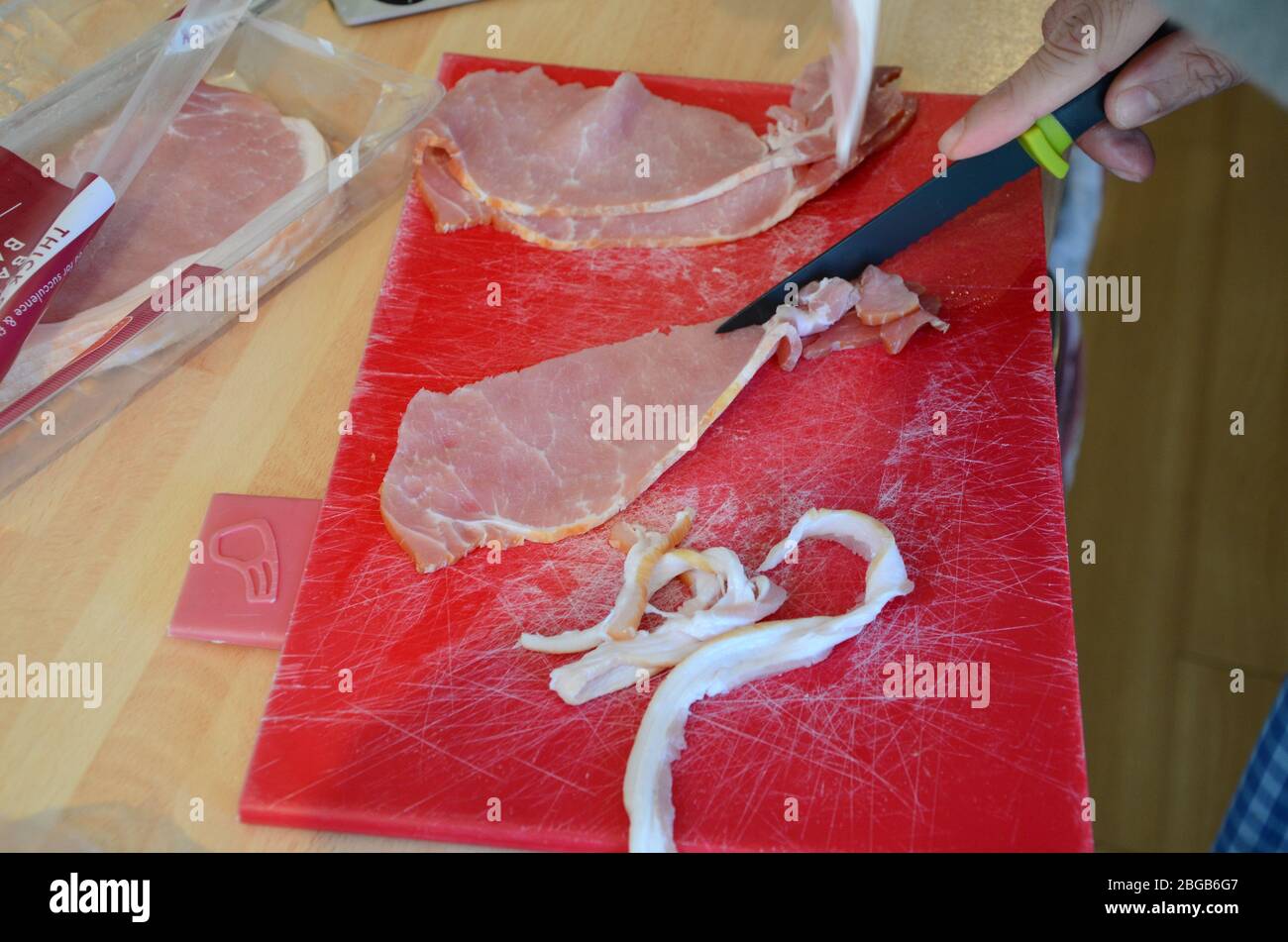 thick cut smoked back Bacon, food preparation Stock Photo