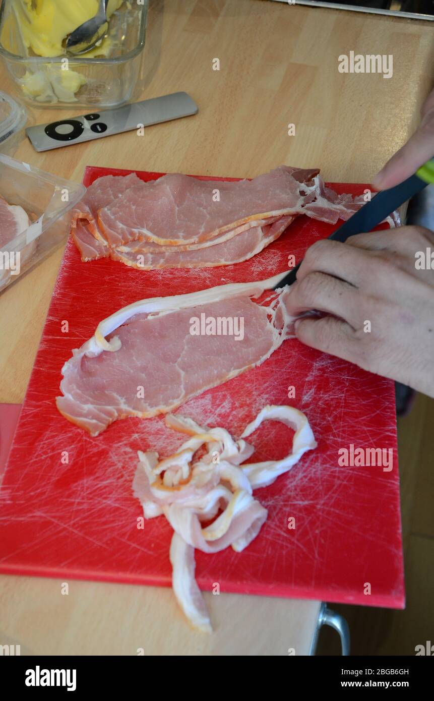 thick cut smoked back Bacon, food preparation Stock Photo