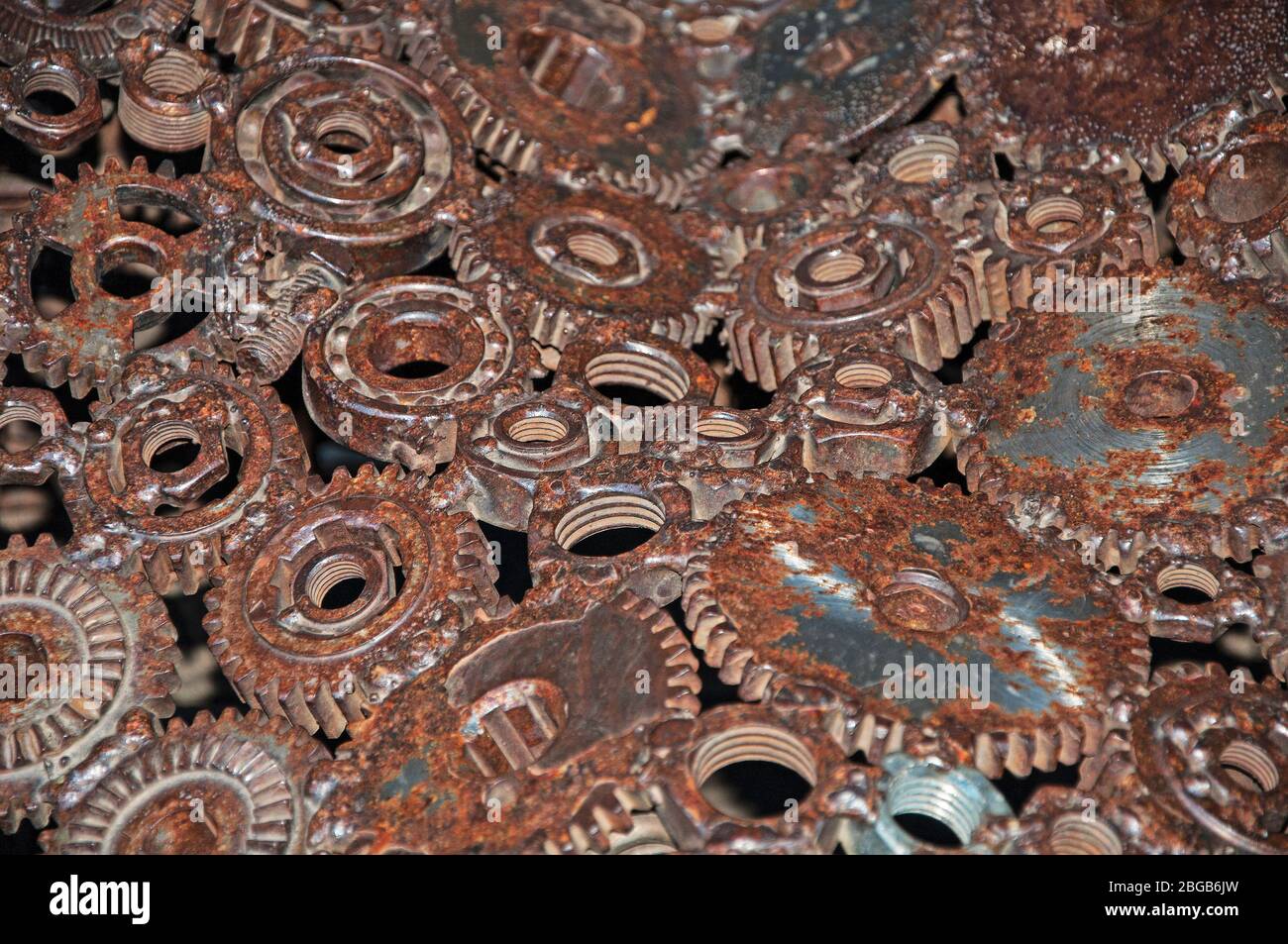 Old, worn, rough mechanical gears made of rusty metal. Design minimalism. Iron composition. Retro style. Stylish top and trendy design background text Stock Photo