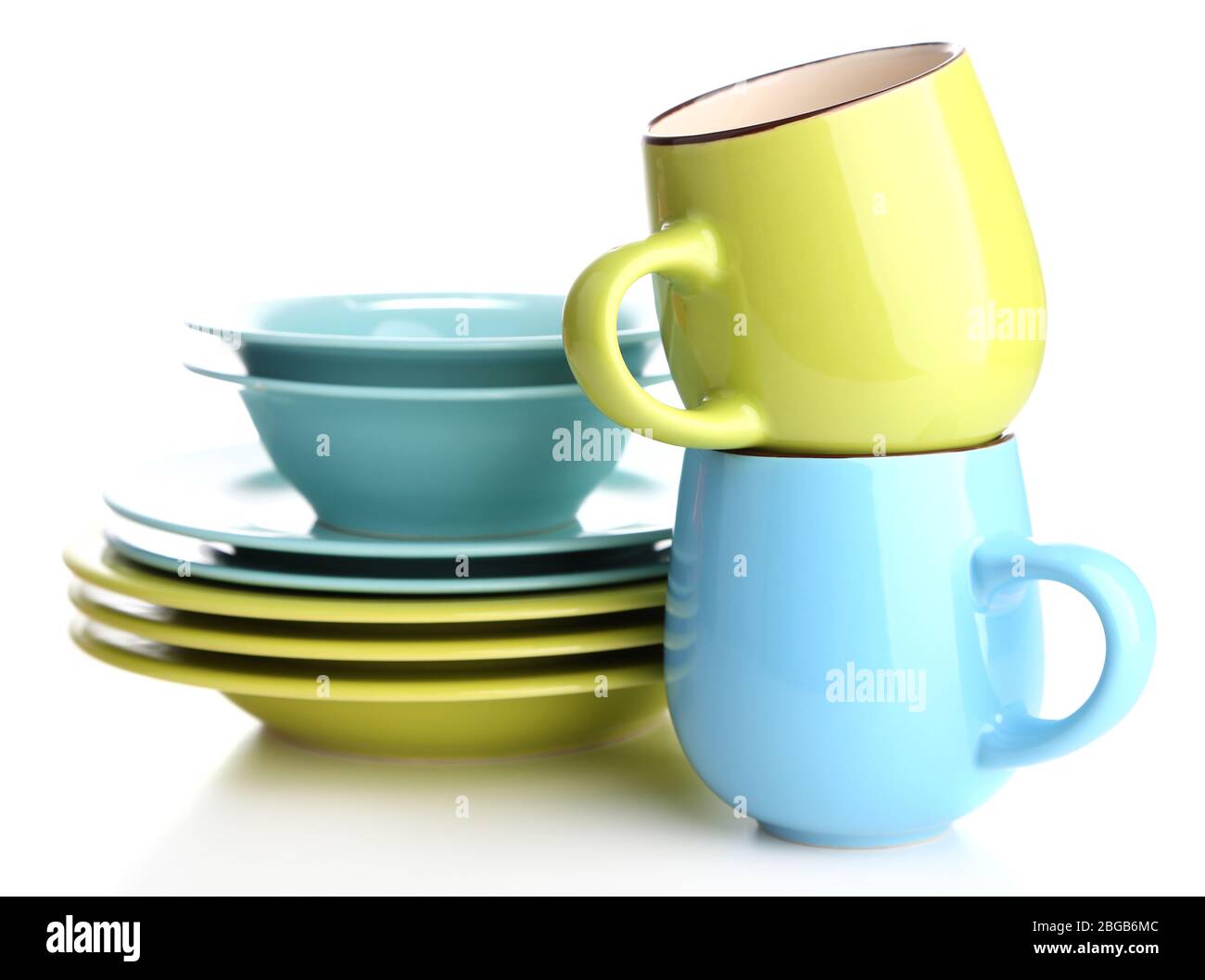 Clean colorful tableware isolated on white Stock Photo - Alamy