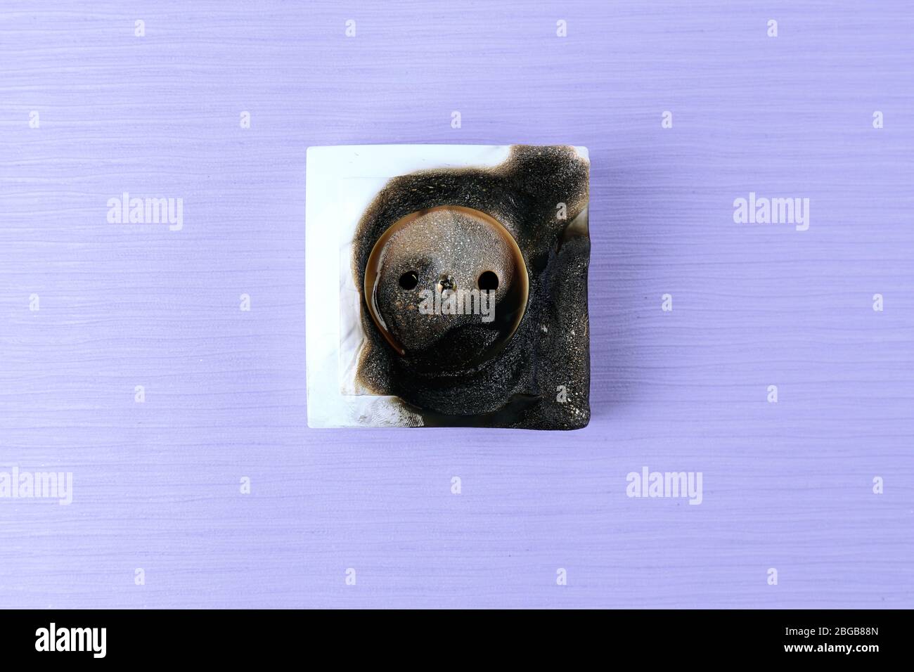 Burned plug socket close up Stock Photo Alamy
