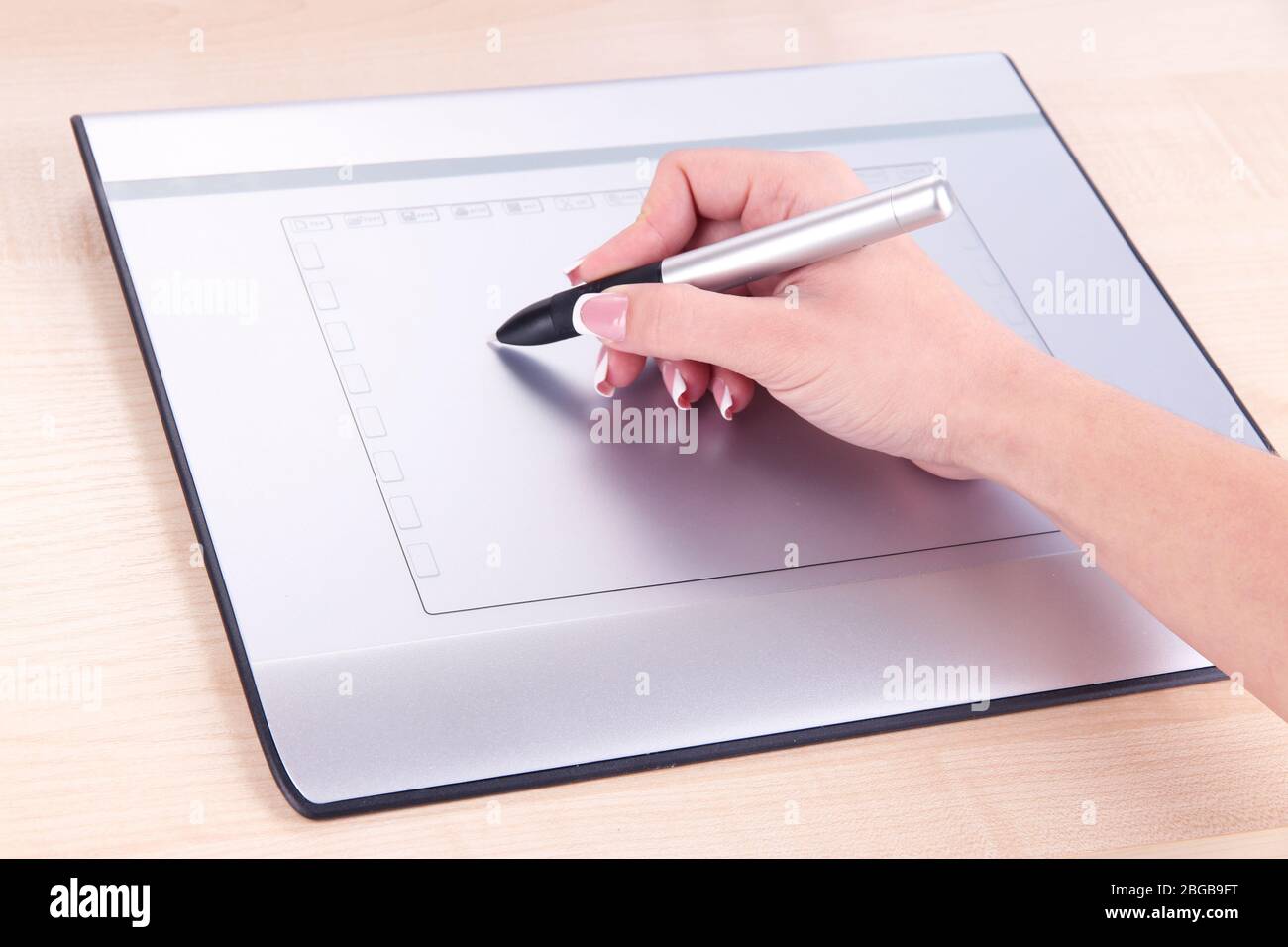 Female hand using graphics tablet on table close up Stock Photo