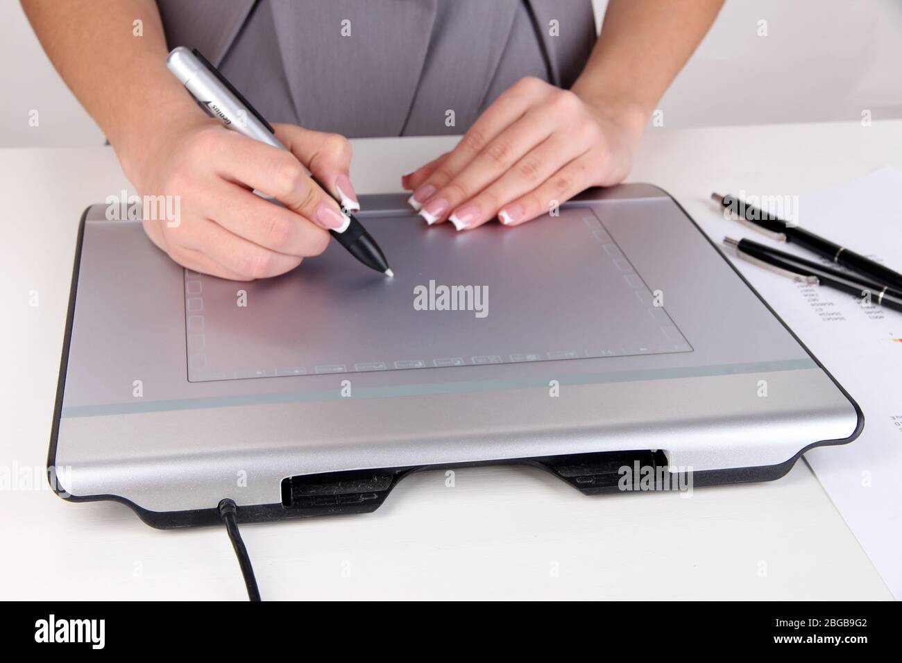 Female hand using graphics tablet on table close up Stock Photo