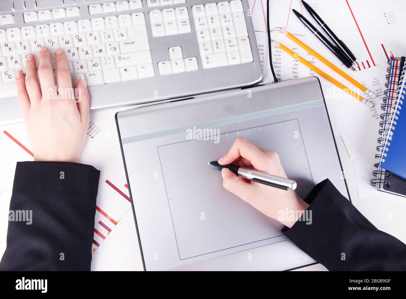 Female hand using graphics tablet on table close up Stock Photo - Alamy