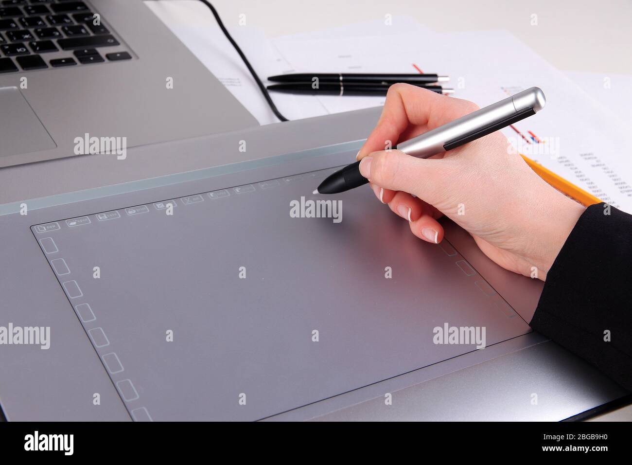 Female hand using graphics tablet on table close up Stock Photo