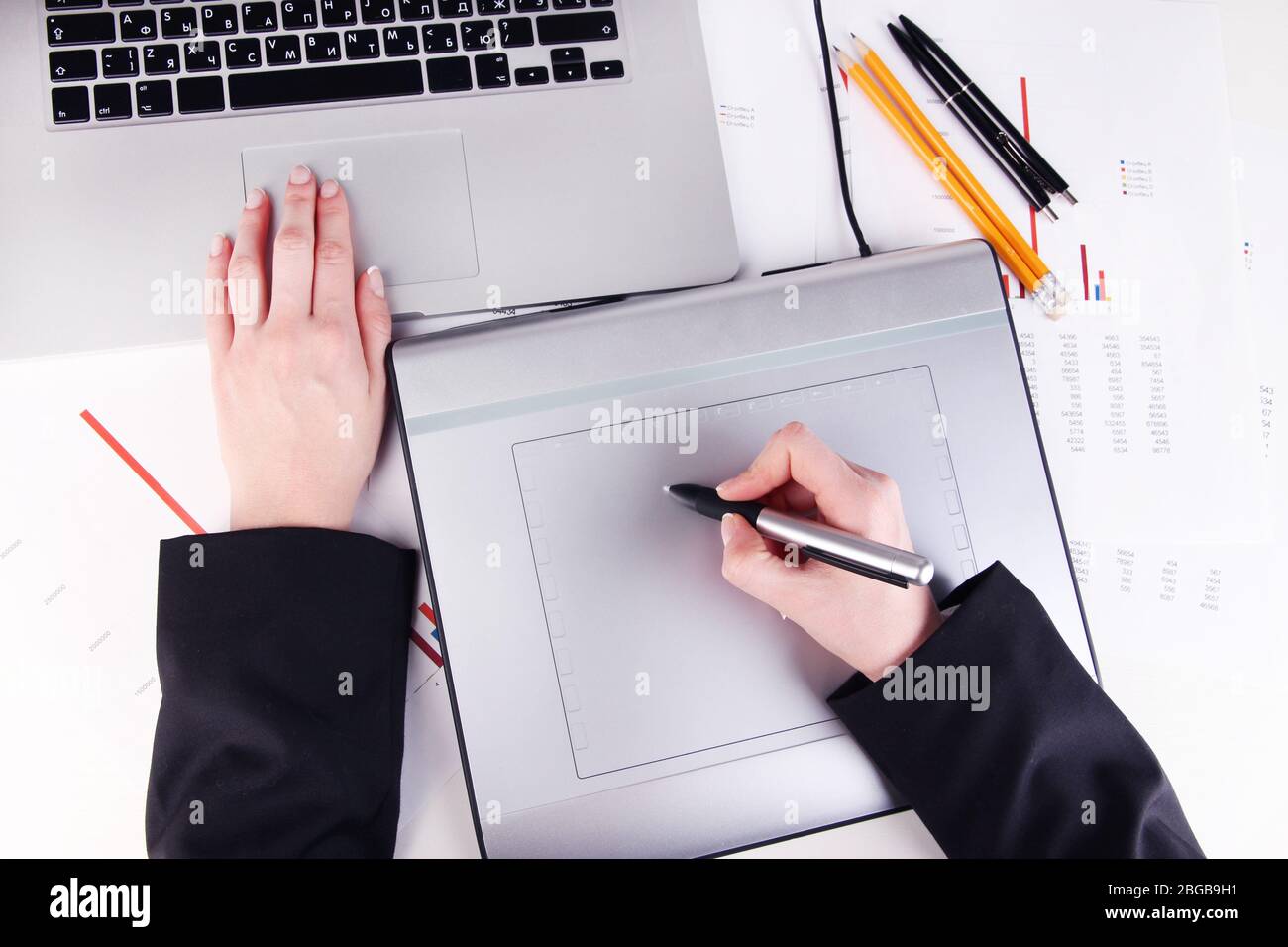 Female hand using graphics tablet on table close up Stock Photo