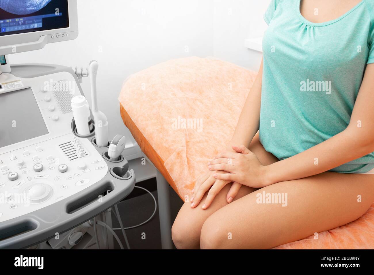 Transvaginal examination of uterus and ovaries. Gynecology. Ultrasound office Stock Photo