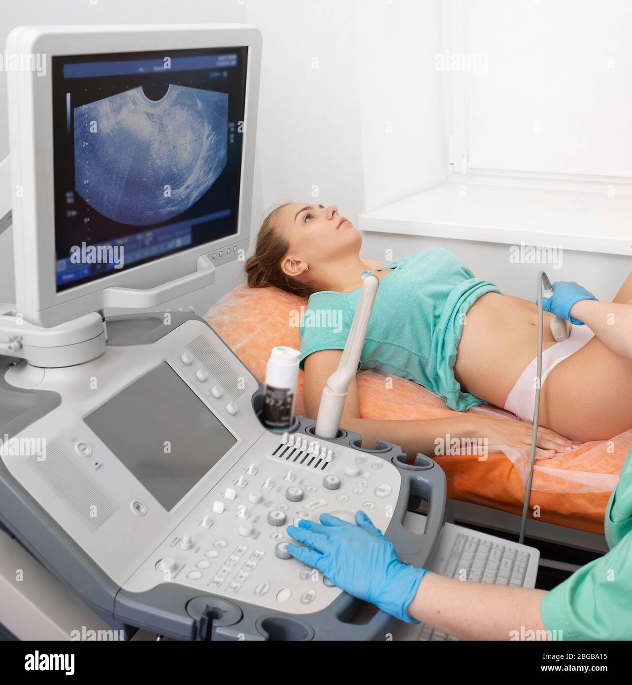 Young patient during ovarian ultrasound exam. Women's health, examination by a gynecologist Stock Photo