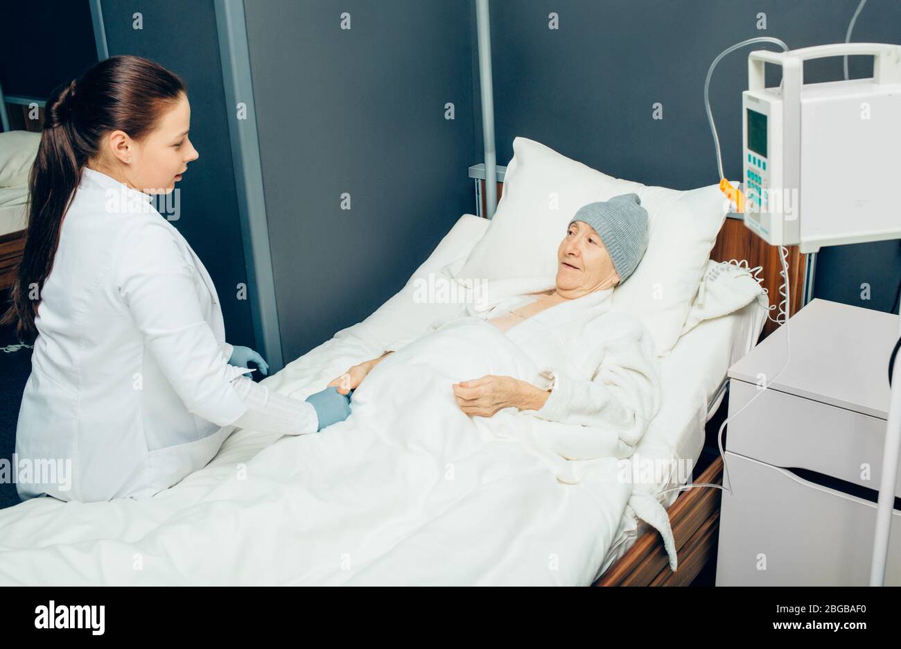 doctor consults a woman patient in an oncology clinic. Cancer, Oncology. Cancer treatment with chemotherapy. Stock Photo