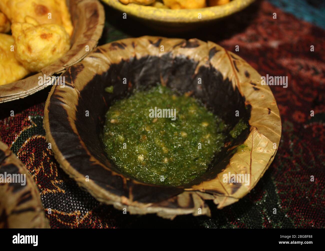 green chutney,coriander mint crush for chaat served in disposable plate
