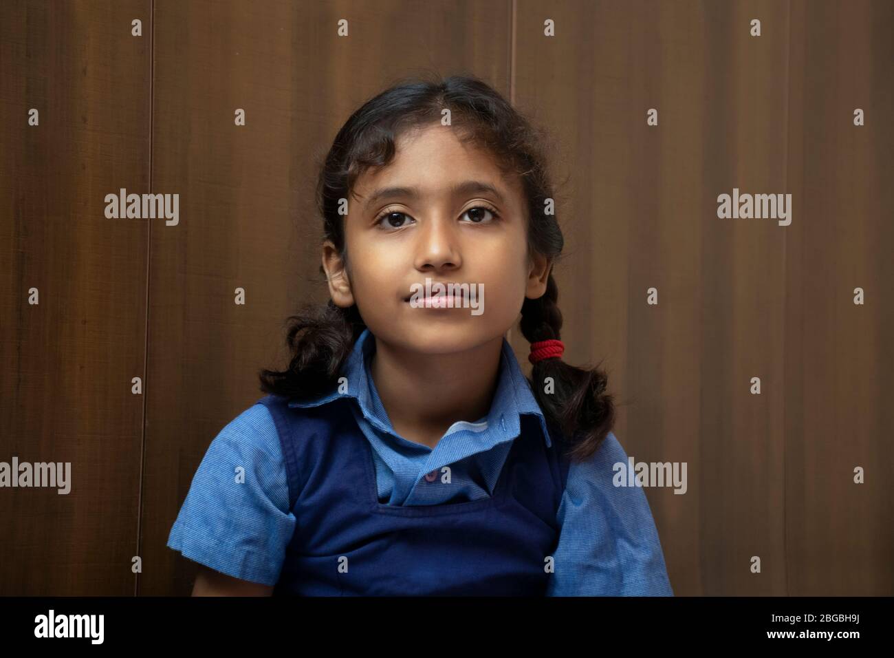 Indian school girl looking at camera Stock Photo