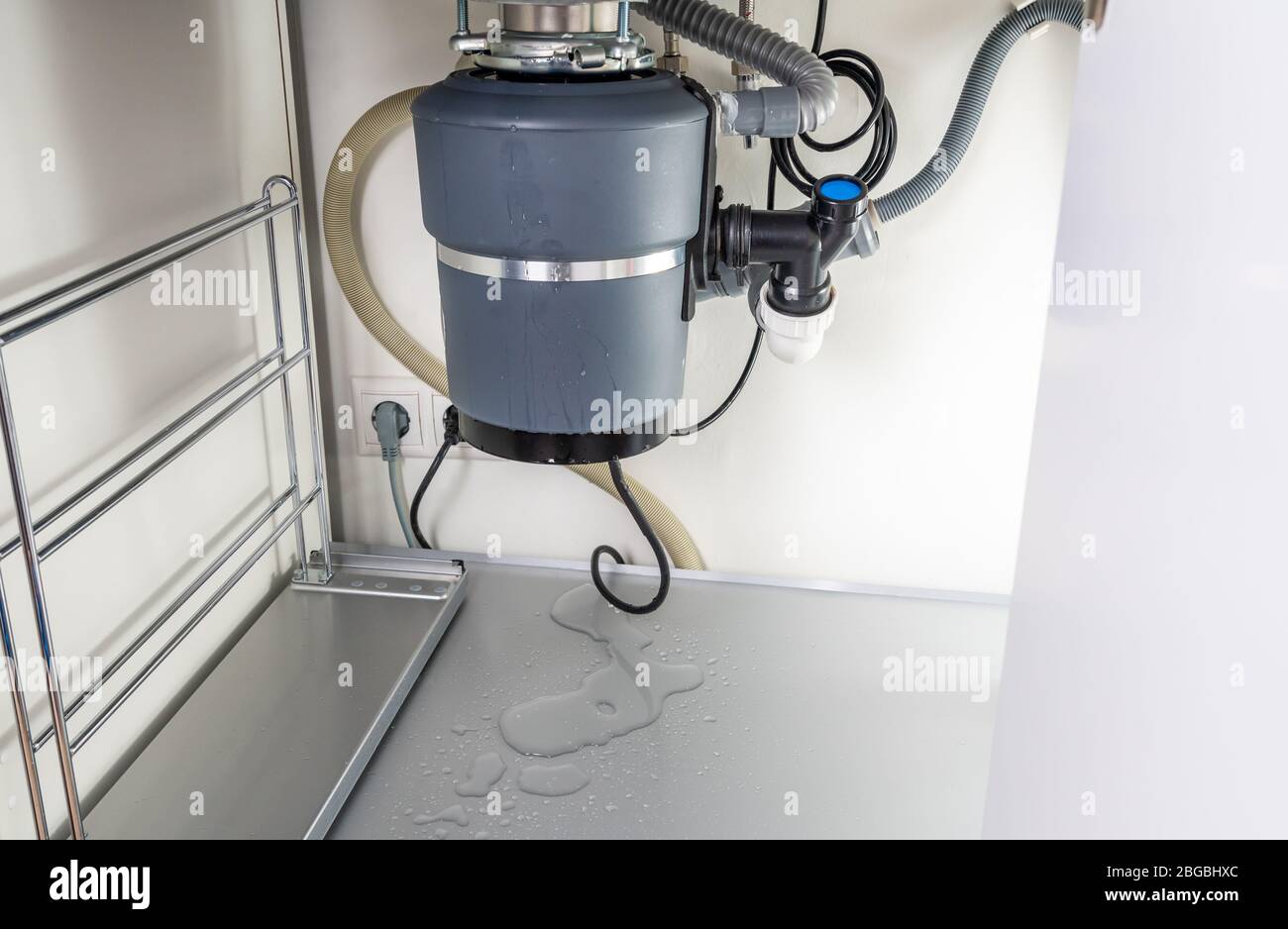 Waste disposal leak under a sink, broken garbage chopper Stock Photo Alamy