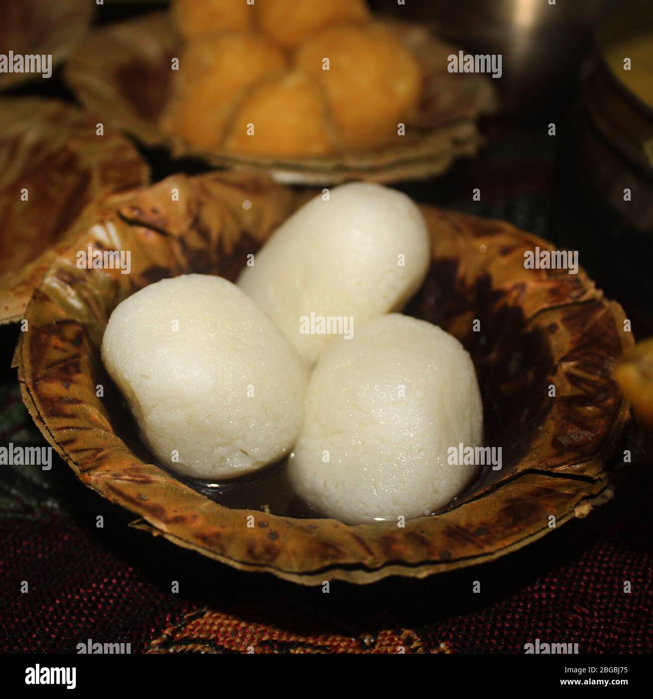 Rasgulla Indian Food served in disposable plate made from dry leaf with ...