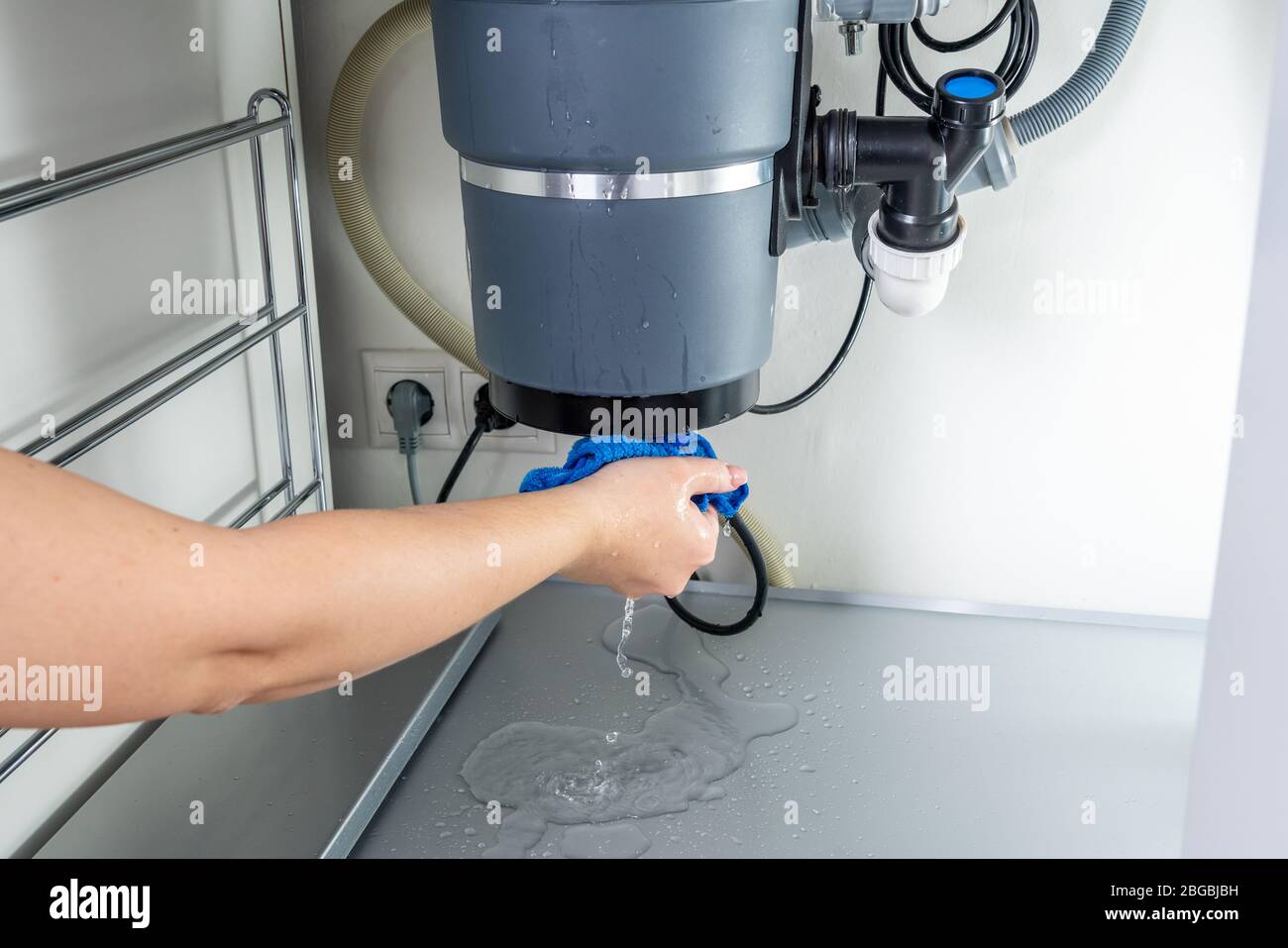 Waste disposal leak under a sink, broken garbage chopper Stock Photo Alamy