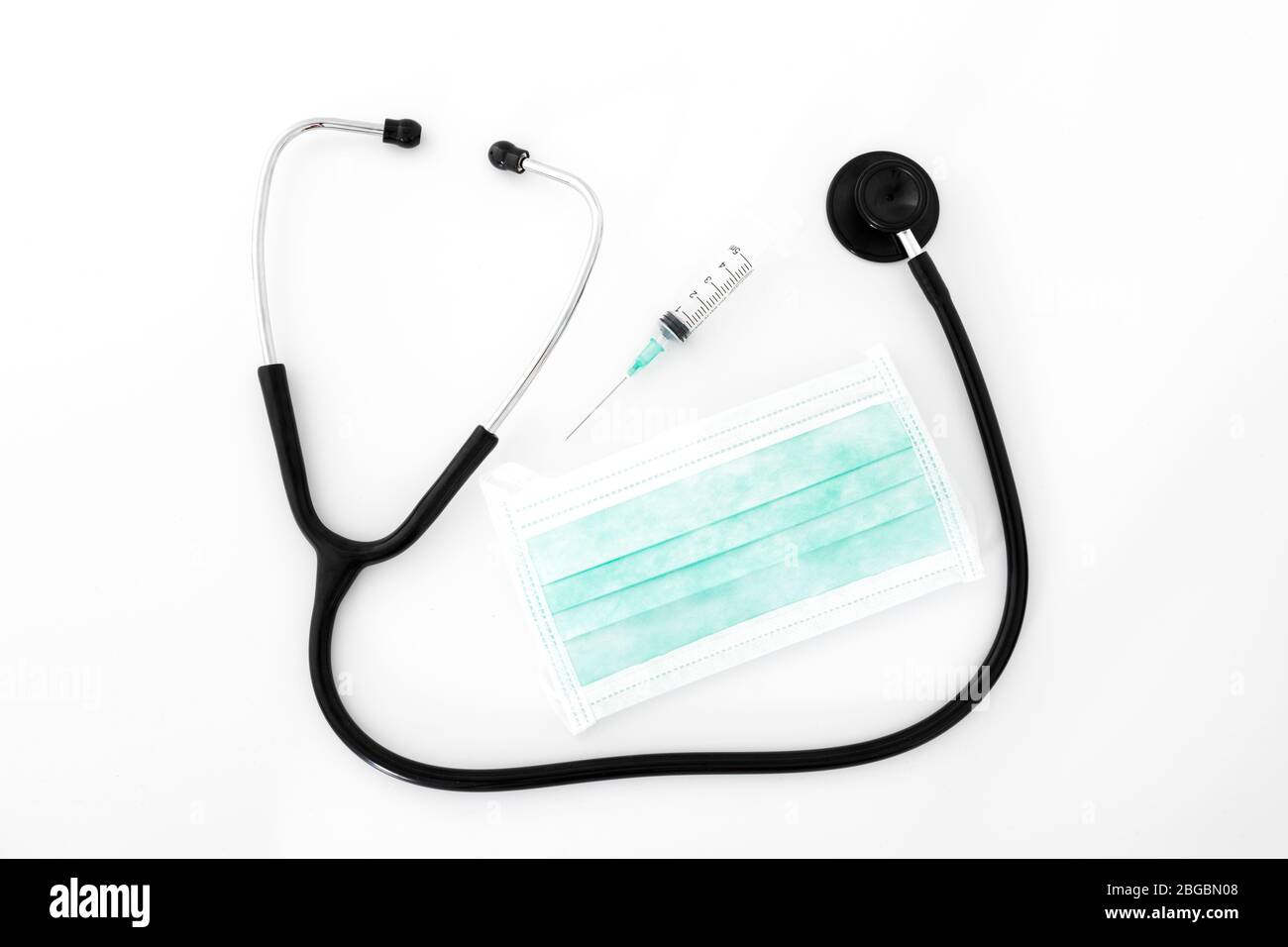 Stethoscope, syringe and mask on white background Stock Photo - Alamy