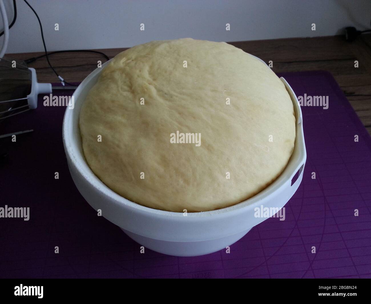 Yeast dough rises in the bowl Stock Photo Alamy