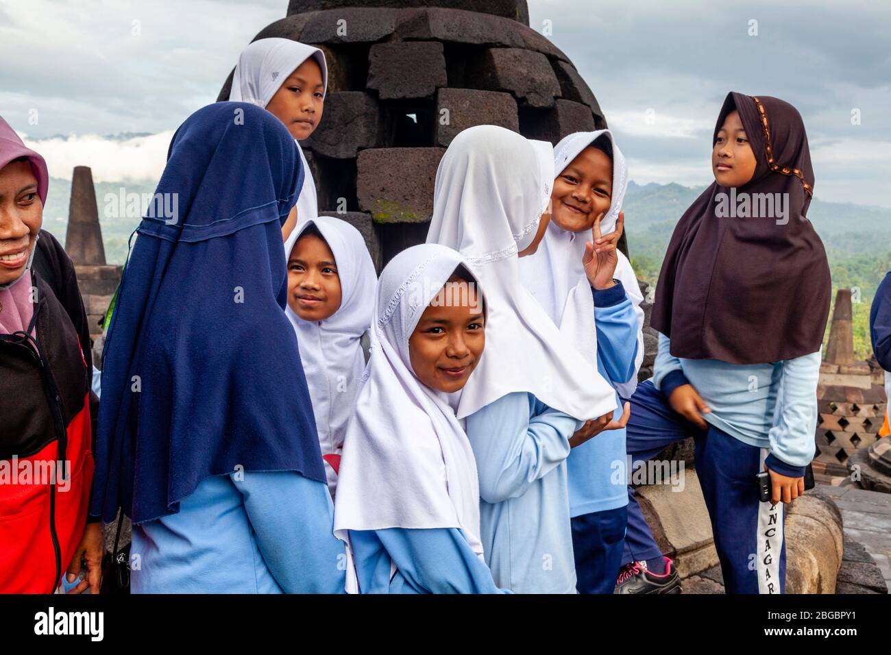 A Group Of Indonesian Schoolchildren Visiting Borobudur Temple, Yogyakarta, Central Java, Indonesia Stock Photo