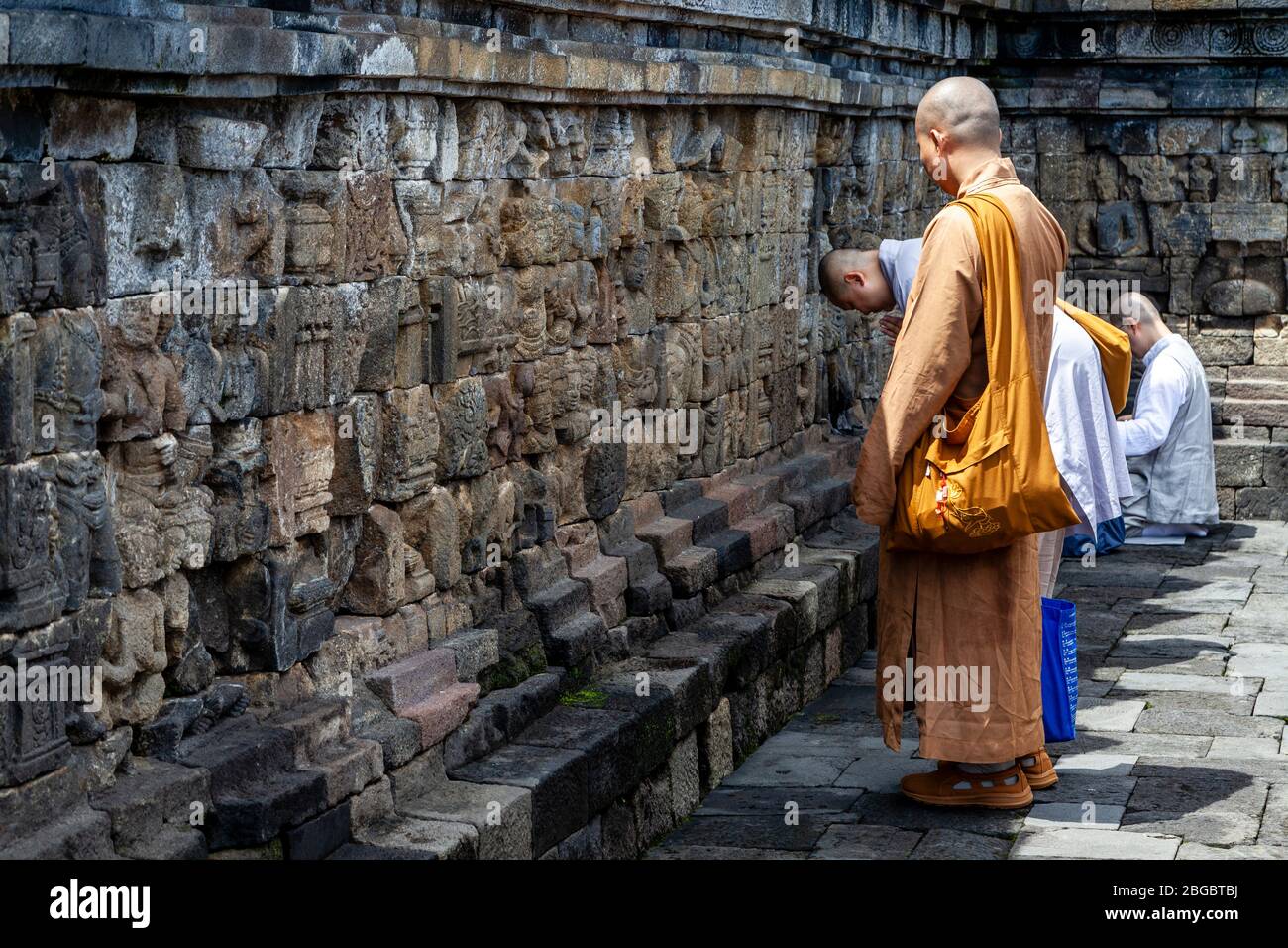 A Group Of Buddhist Monks Praying At Borobudur Temple, Yogyakarta, Central Java, Indonesia Stock Photo