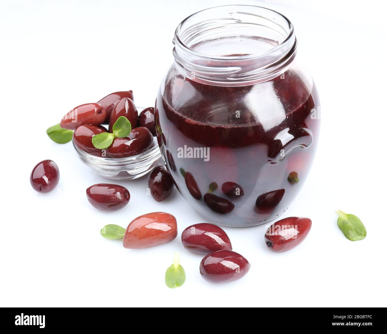 Black olives in glass jar, isolated on white Stock Photo Alamy