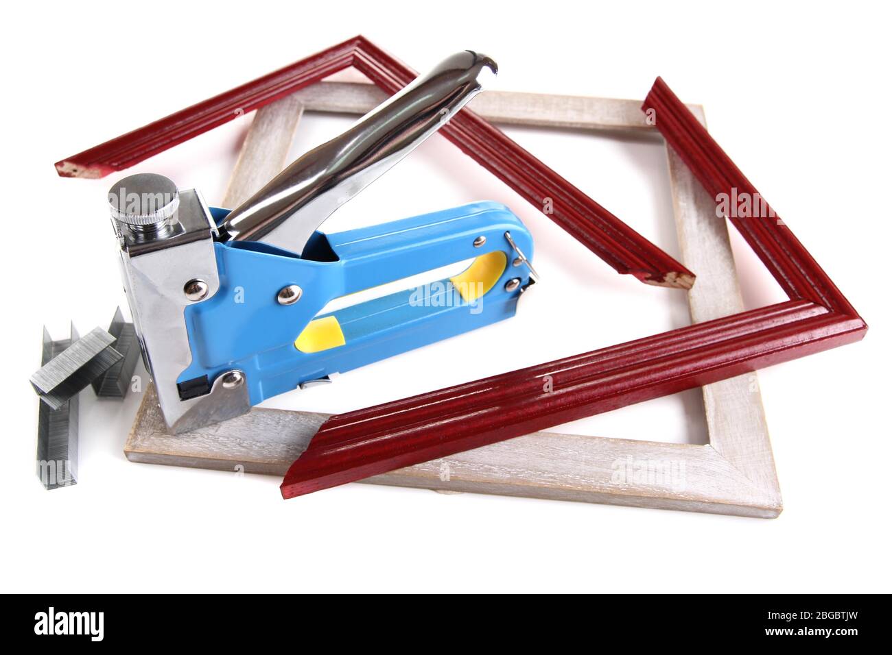 Construction stapler and wooden frames isolated on white Stock Photo