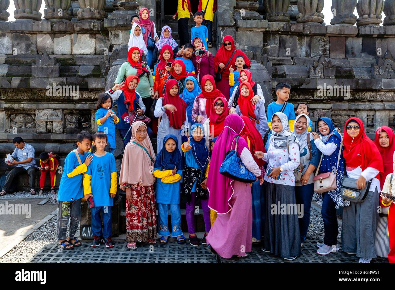 A Group Of Indonesian Visitors At The Prambanan Temple Compounds, Yogyakarta, Central Java, Indonesia. Stock Photo