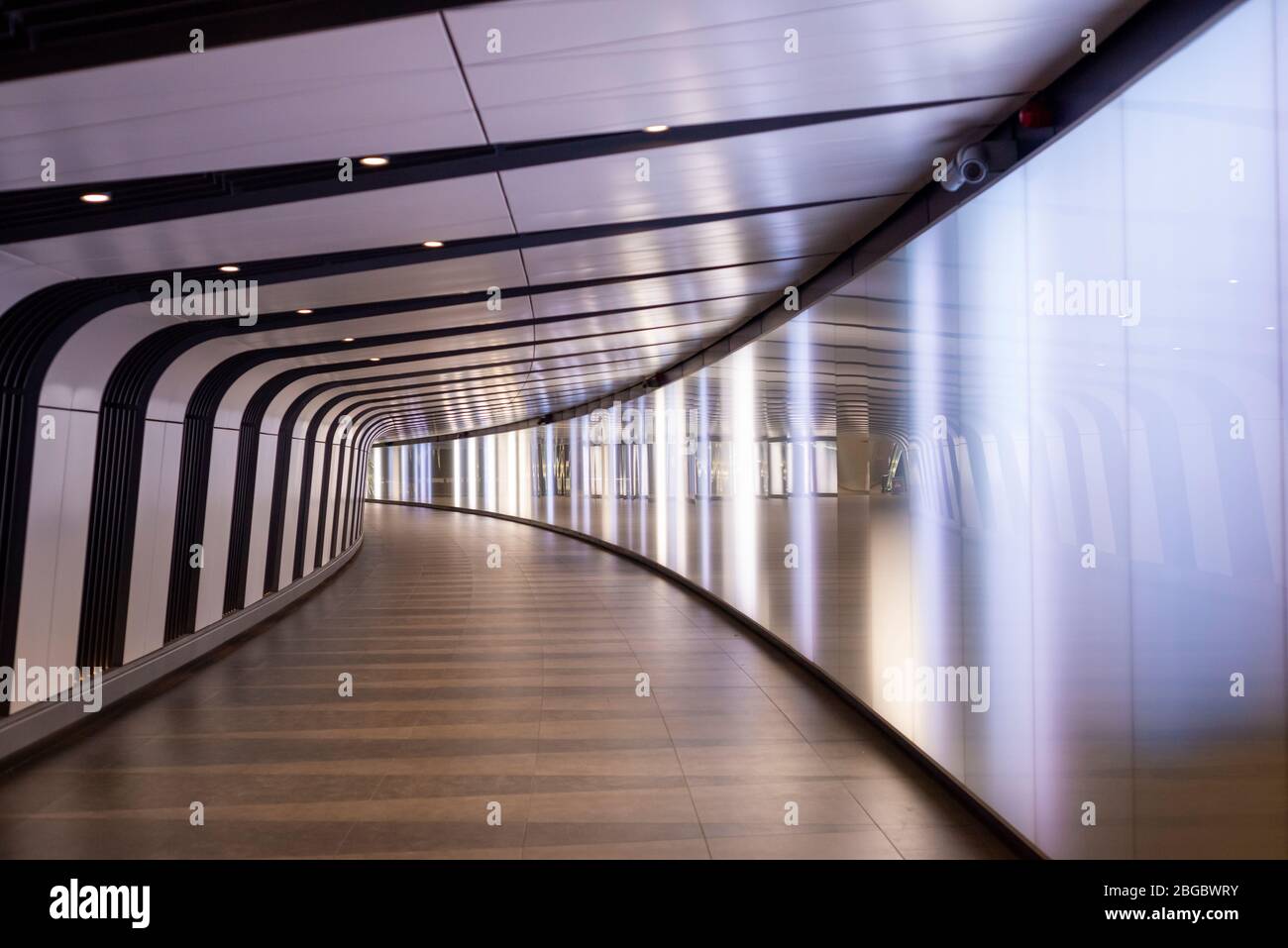 London underground interior and no people in the empty illuminated pedestrian light tunnel at St Pancras Underground Station in London, United Kingdom Stock Photo
