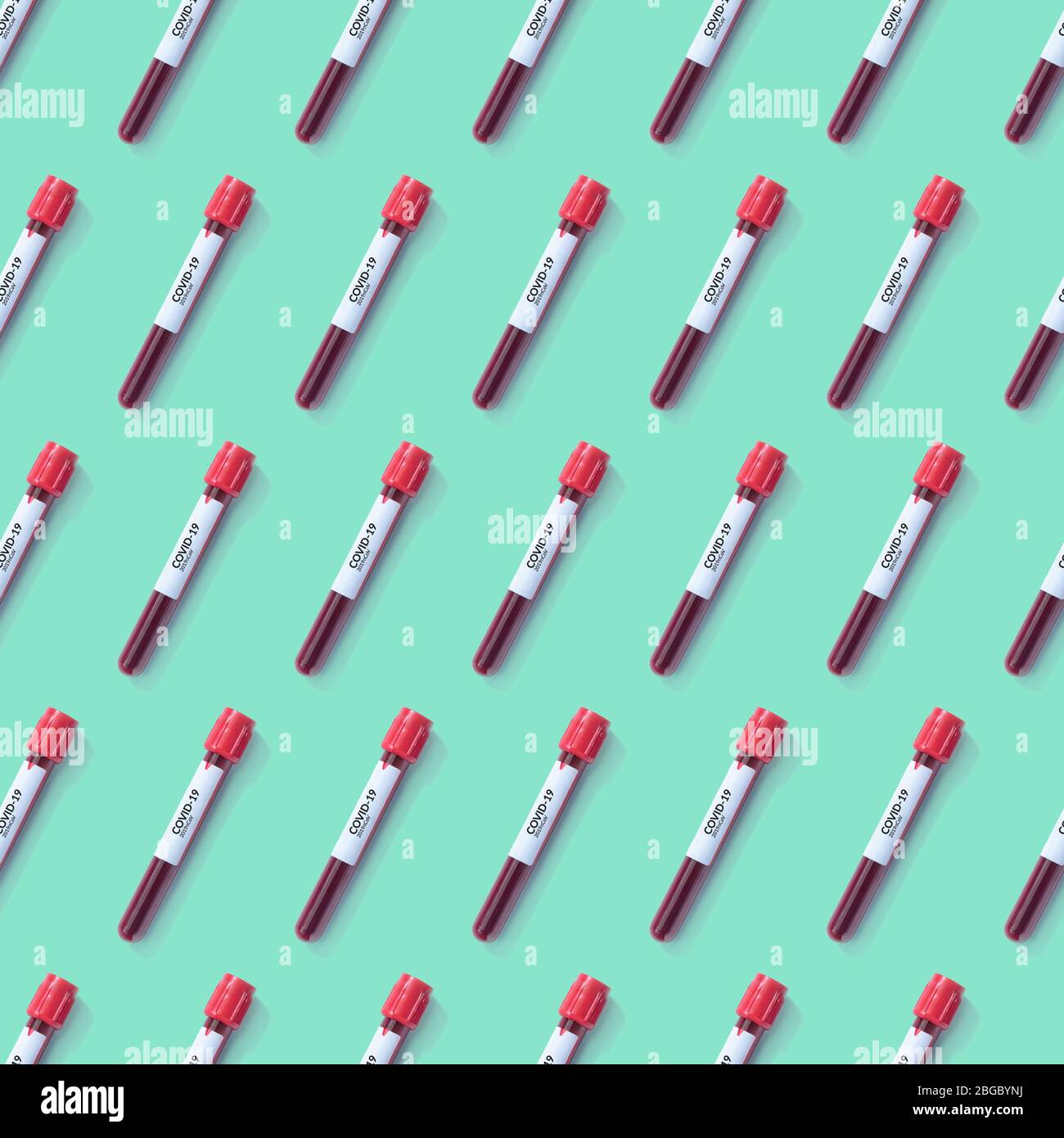 test tube with antibody blood sample with covid-19 label tag for analyzing isolated on green seamless background. laboratory testing, invent drug and Stock Photo