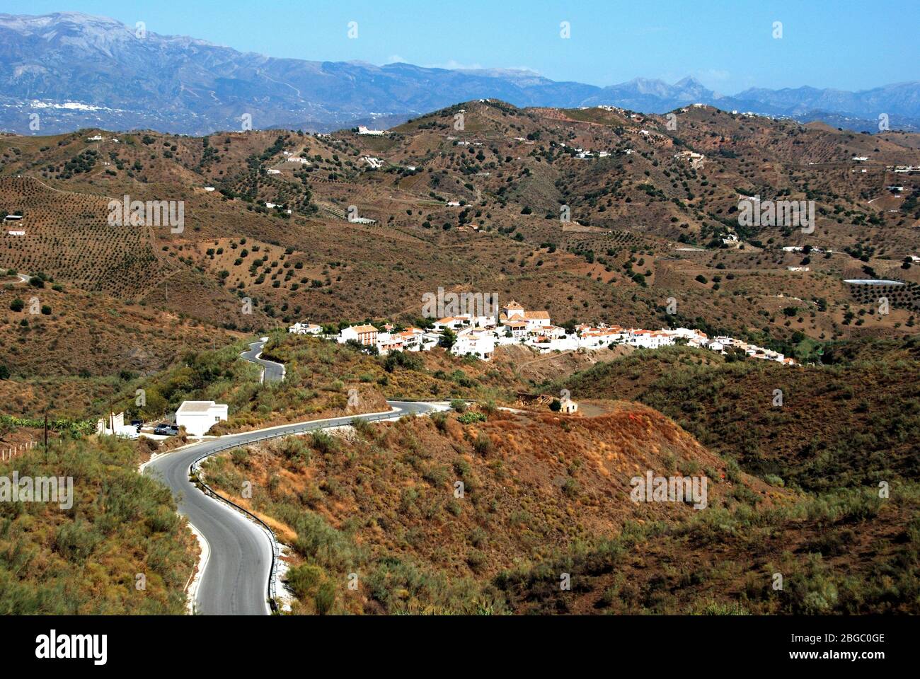 View of white village and surrounding countryside, Macharaviaya, Malaga Province, Andalucia, Spain, Western Europe. Stock Photo