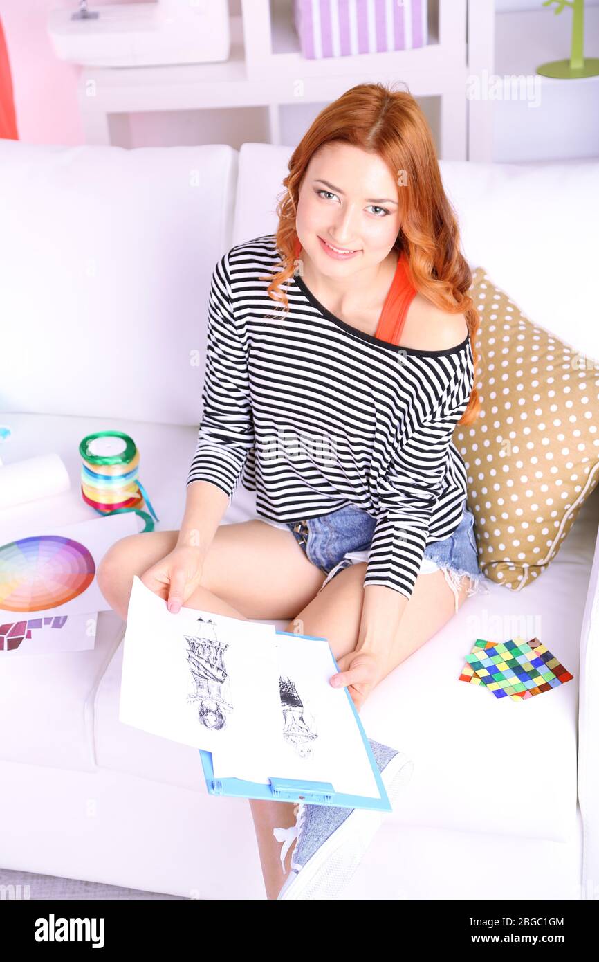 Young girl fashion designer draws new sketches collection Stock Photo ...