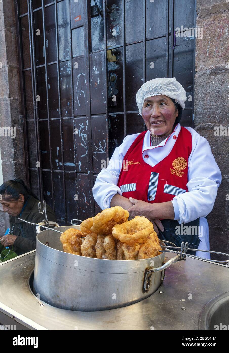 Street vendor selling produce at San Pedro Market in Cusco, Peru Stock Photo