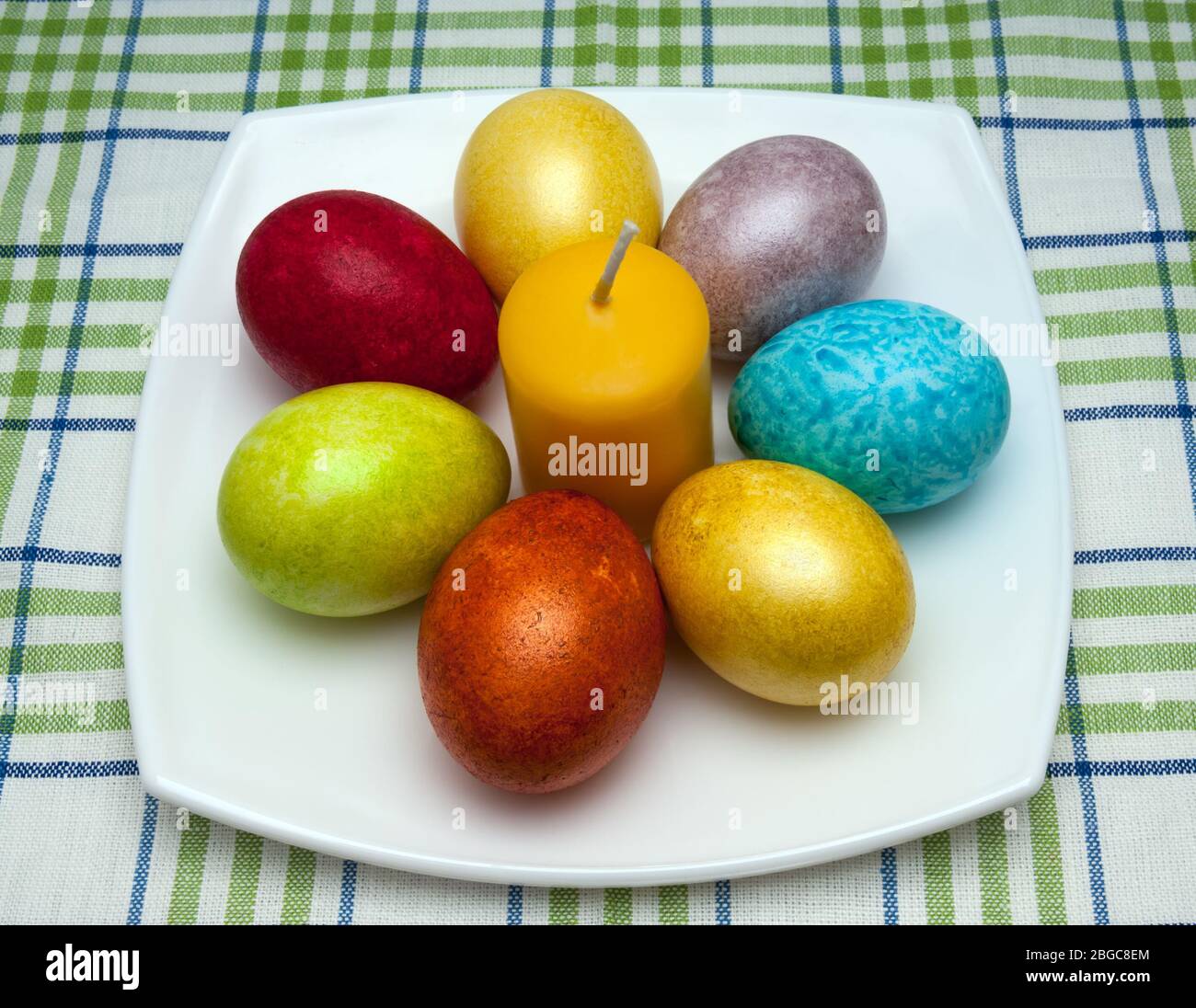 Coloured eggs for easter on white plate Stock Photo