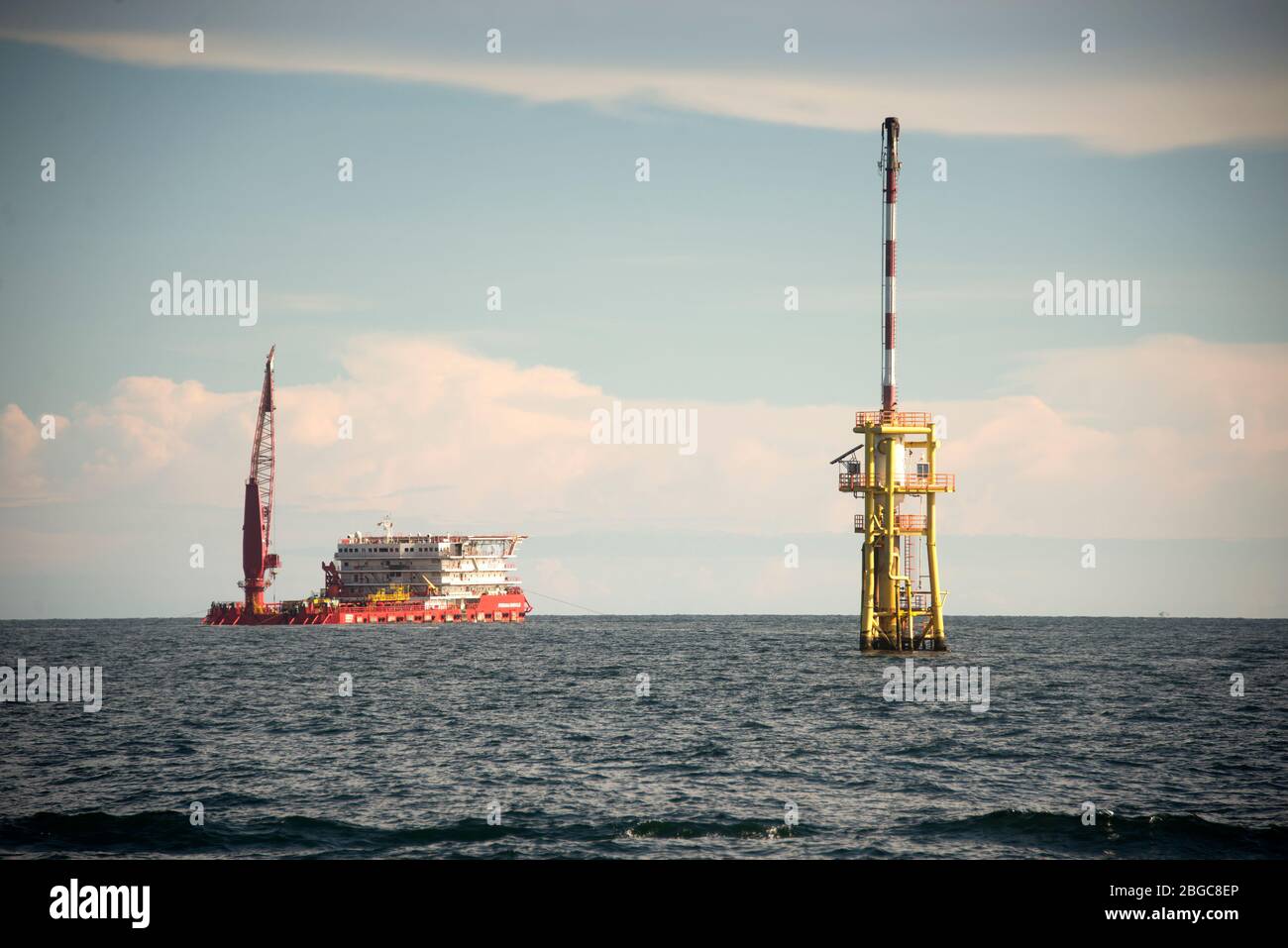 accommodation work boat or AWB anchorage at oil field for oil platform maintenance Stock Photo