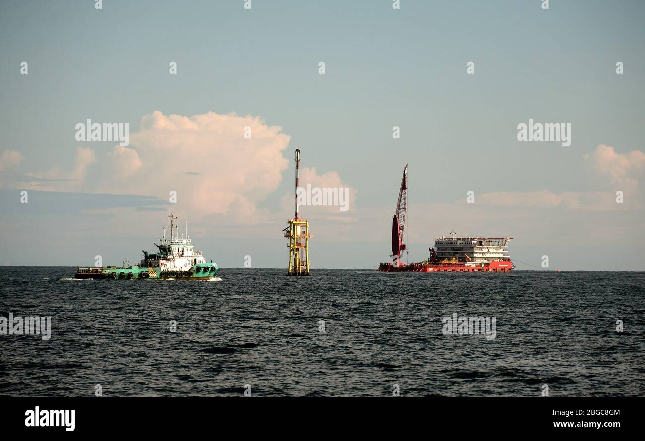 accommodation work boat or AWB anchorage at oil field for oil platform maintenance Stock Photo