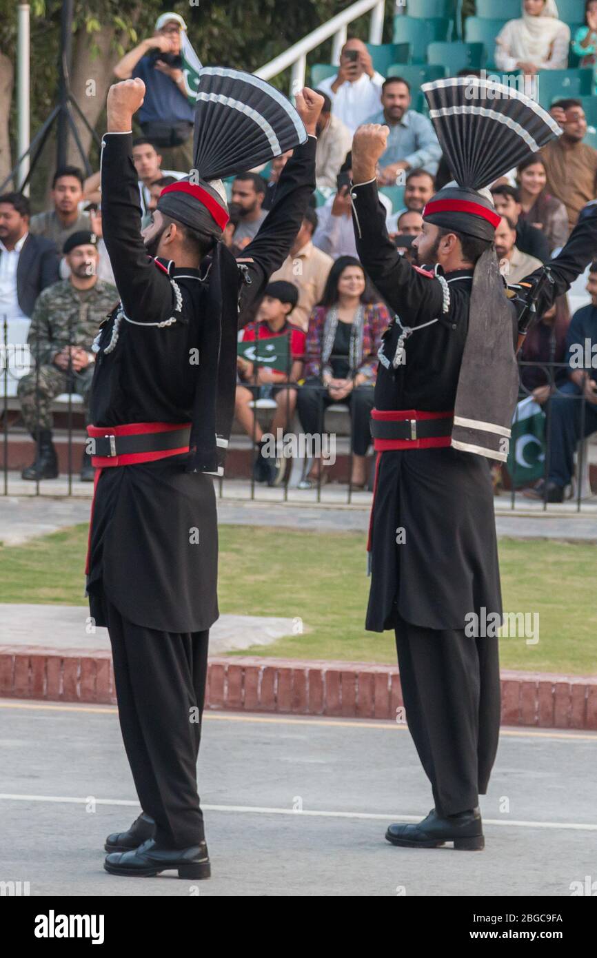 Wagah Border Ceremony on the border between Pakistan and India. Soldiers from both countries engage in a 30 minute military display. Stock Photo