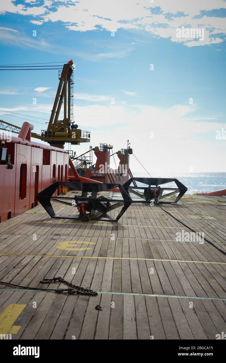 four point anchor handling operation  carried out on deck vessel for oil rig at sea Stock Photo