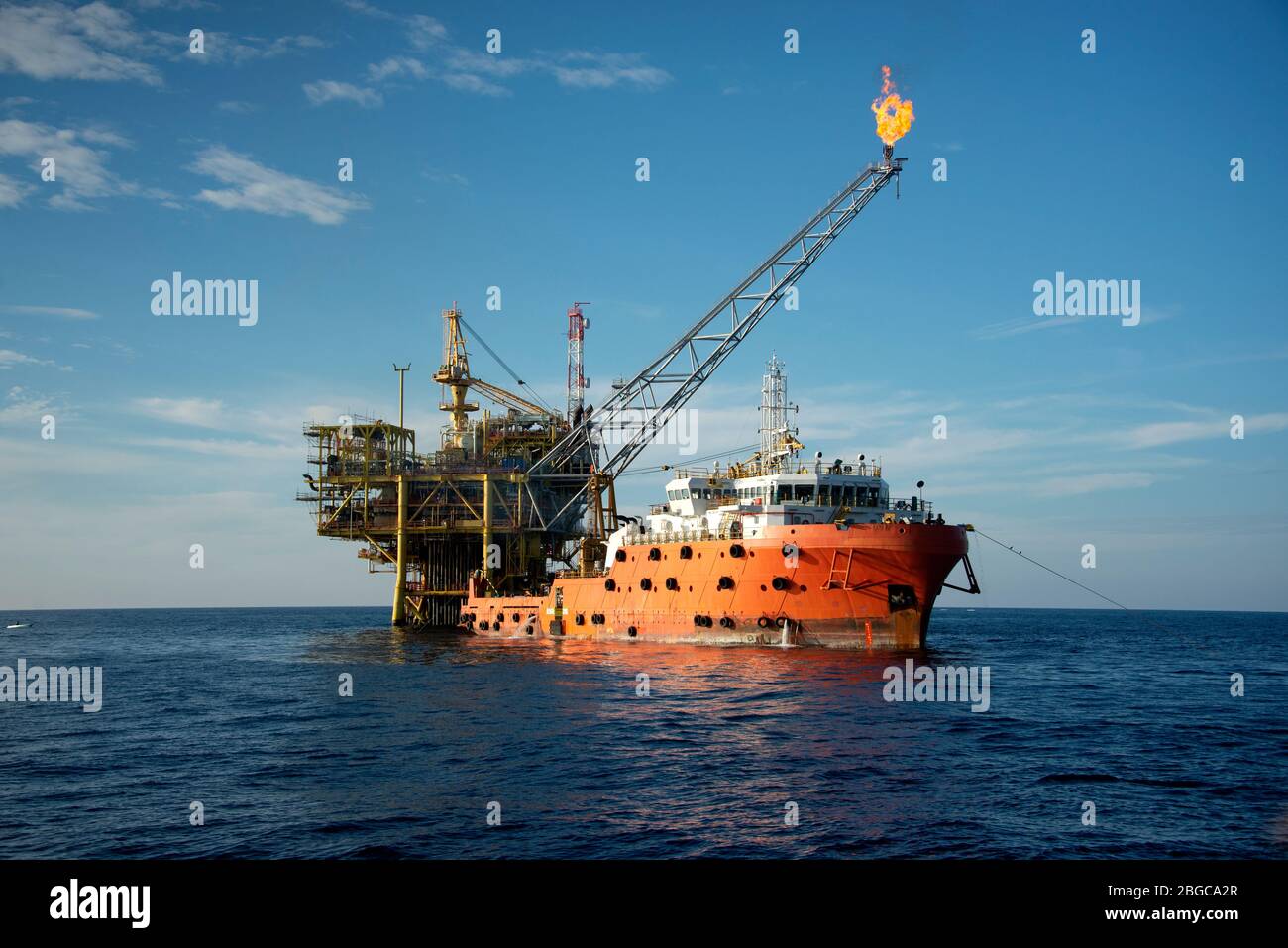 accommodation work barge alongside to oil platform offshore platform maintenance Stock Photo