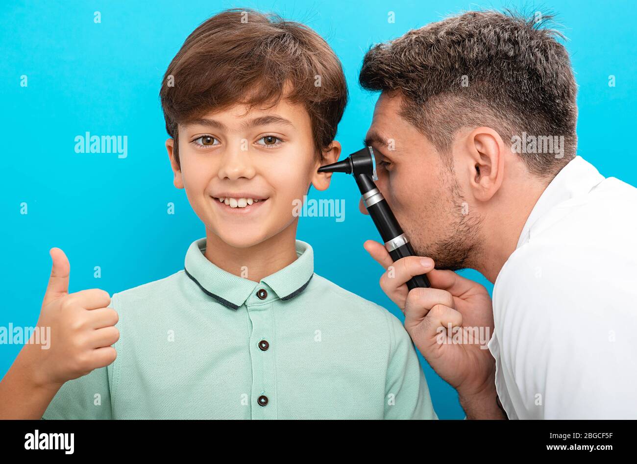 Audiologist check ear to a little boy. Hearing exam and treatment child Stock Photo
