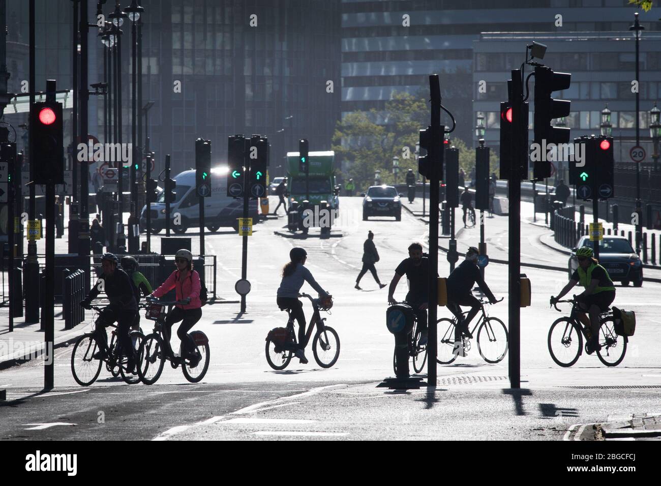 Workers and cyclists in Westminster early this morning as the UK continues in lockdown to help curb the spread of the coronavirus. PA Photo. Picture date: Tuesday April 21, 2020. See PA story HEALTH Coronavirus. Photo credit should read: Stefan Rousseau/PA Wire Stock Photo