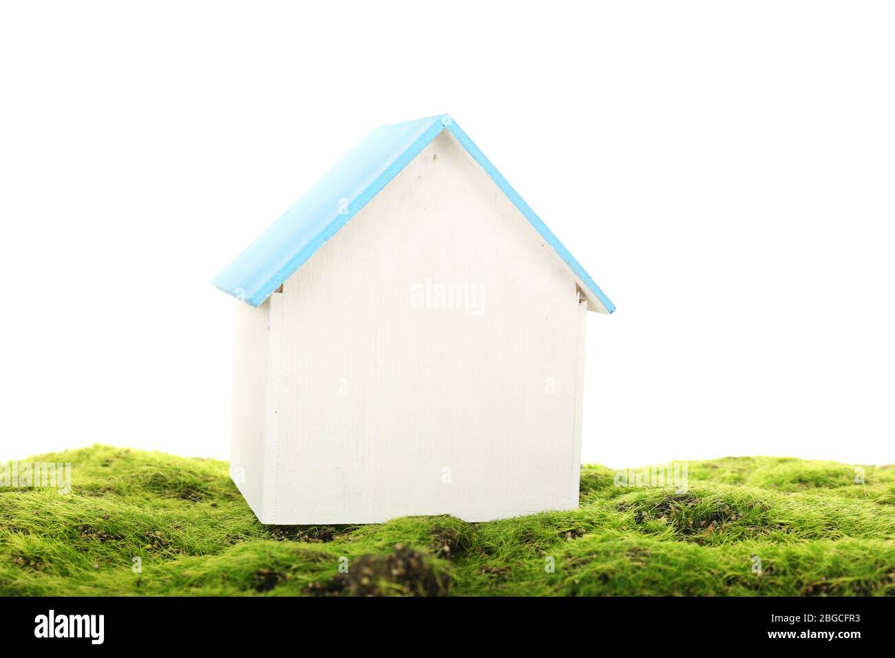 Small wooden house on grass isolated on white Stock Photo - Alamy