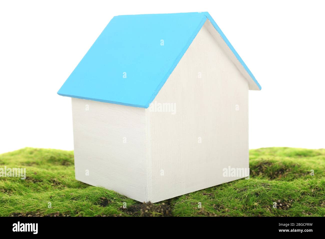 Small wooden house on grass isolated on white Stock Photo - Alamy