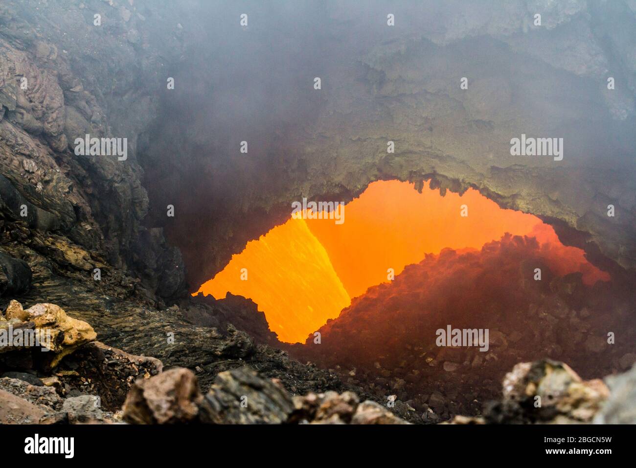 Eruption of Volcano Tolbachik, boiling magma flowing through lava tubes  under the layer of solid lava, Kamchatka Peninsula, Russia Stock Photo -  Alamy