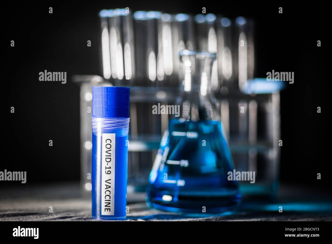 Conceptual image of a recipient containing a vaccine for coronavirus ...