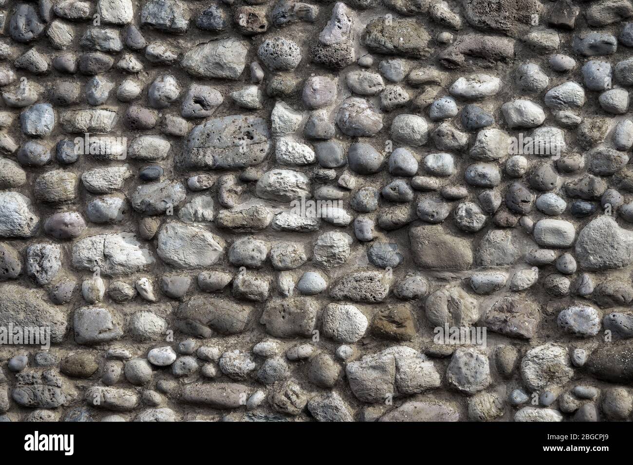 Natural stone wall background Stock Photo - Alamy