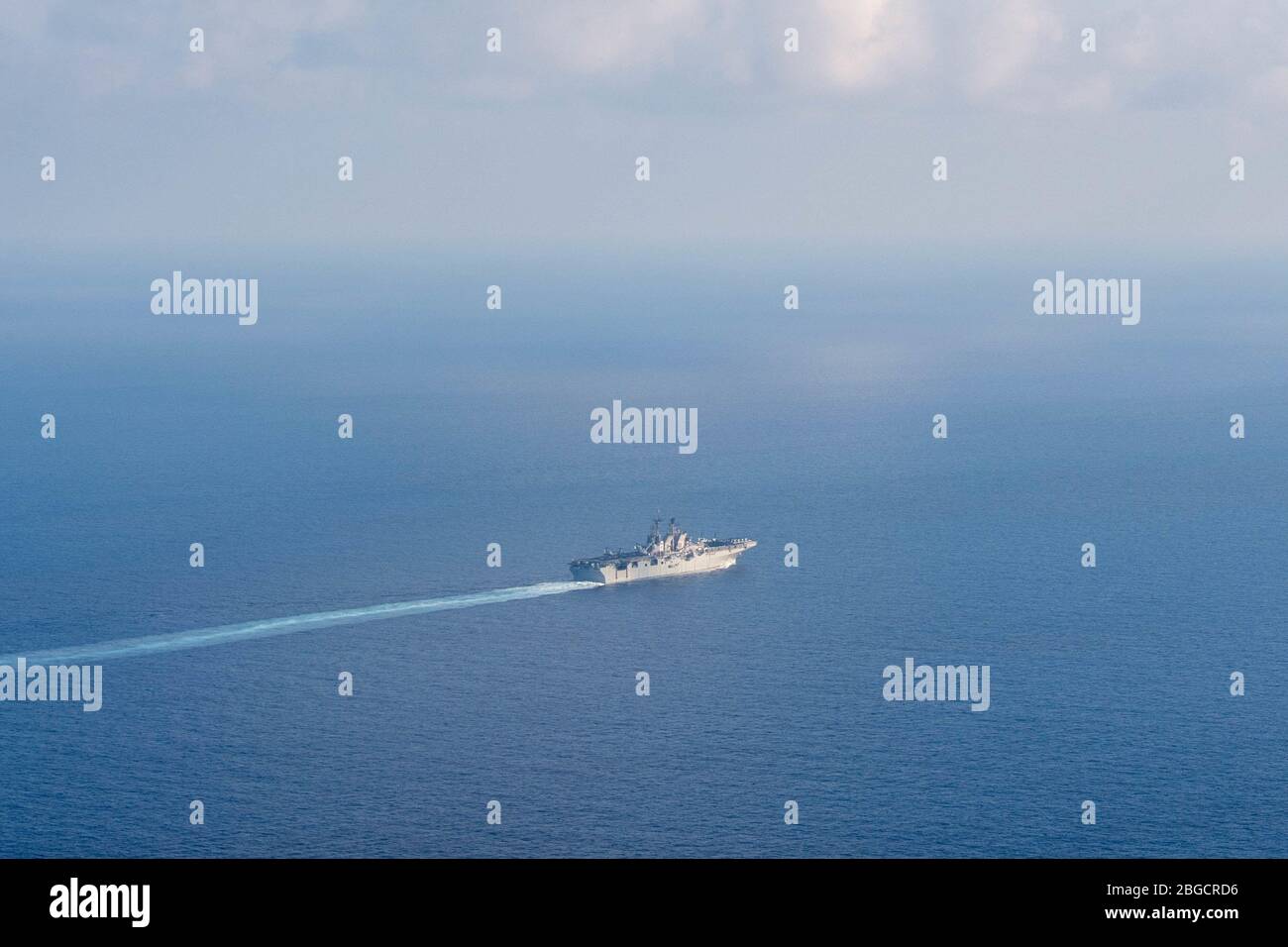 Amphibious assault ship USS America (LHA 6) transits the South China Sea. America, flagship of the America Expeditionary Strike Group, 31st Marine Expeditionary Unit, is operating in the U.S. 7th Fleet area of operations to enhance interoperability with allies and partners and serve as a ready response force to defend peace and stability in the Indo-Pacific region. Stock Photo